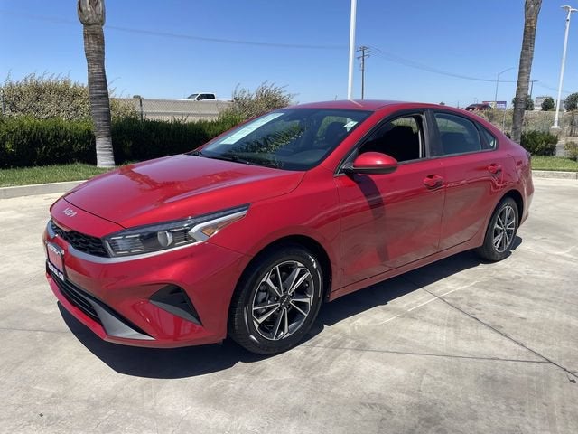 2024 Kia Forte LXS in Red — front three-quarter view